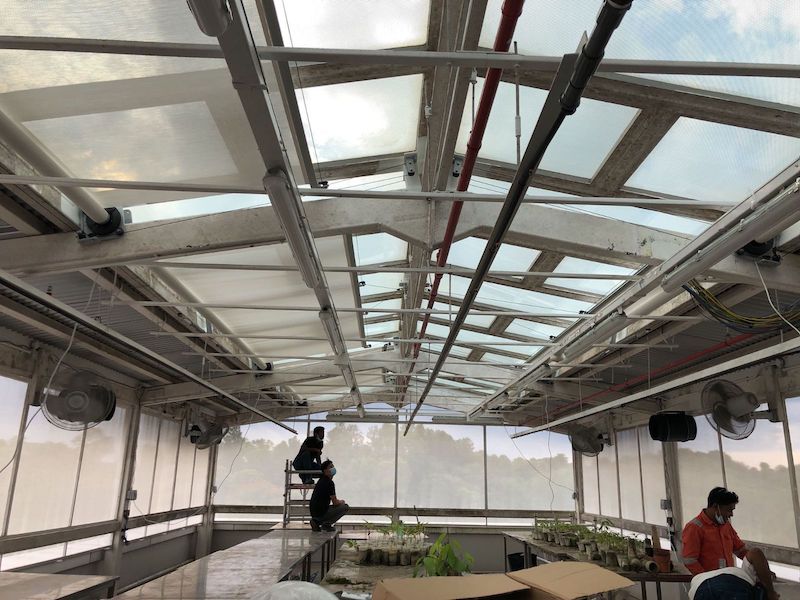 Retractable shading panels partially open, letting light in